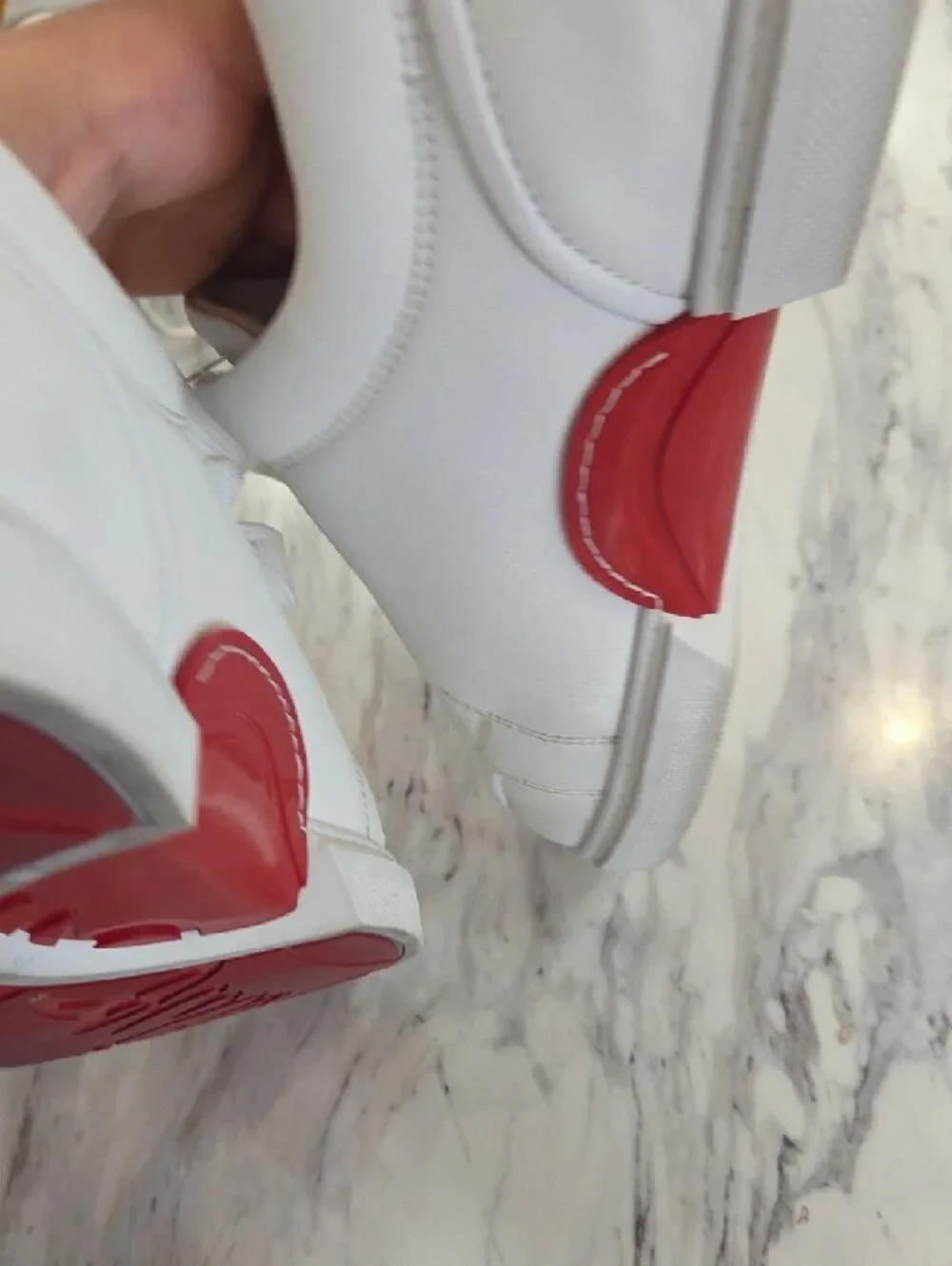 Christian Louboutin White Low-Top Leather Sneakers with Red Heel Accent